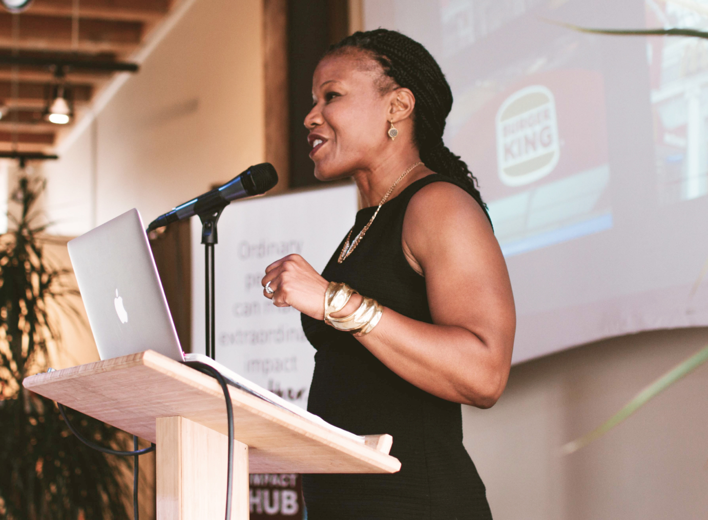 Woman giving a speech at impact hub